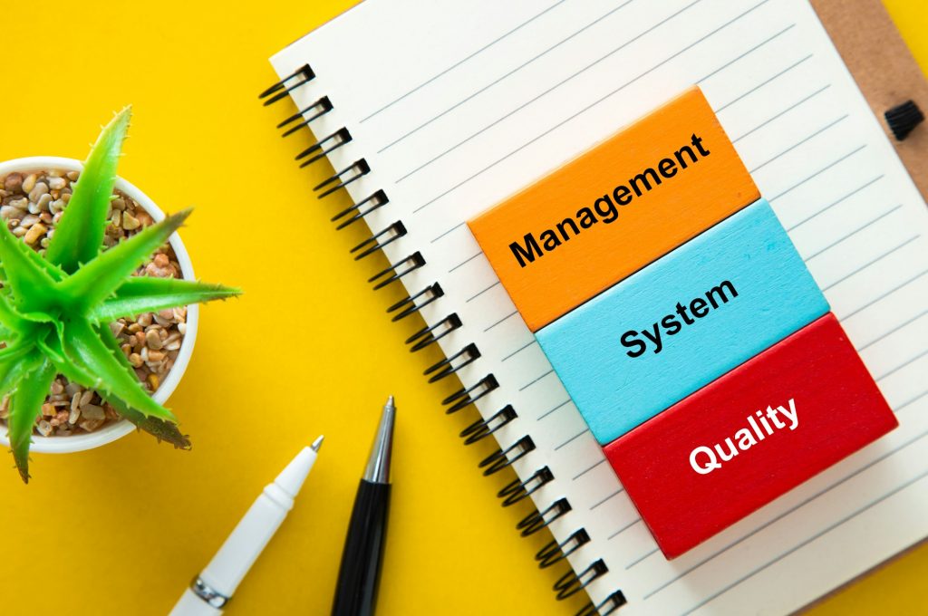 Colored cubes with words quality management and system.