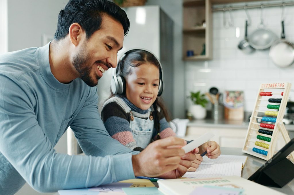 Home, dad and education of child, smile and daughter with headphones, learning and practice of math