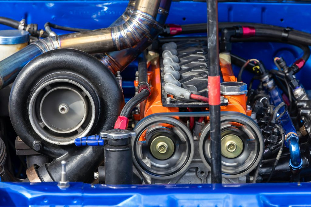 The powerful engine of car, Internal design of engine, Car engine part, Under the hood sports car.